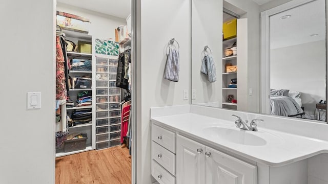 bathroom featuring wood-type flooring and vanity