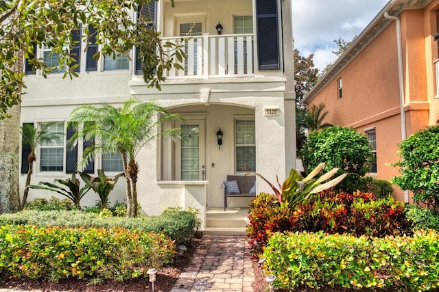 property entrance with a balcony