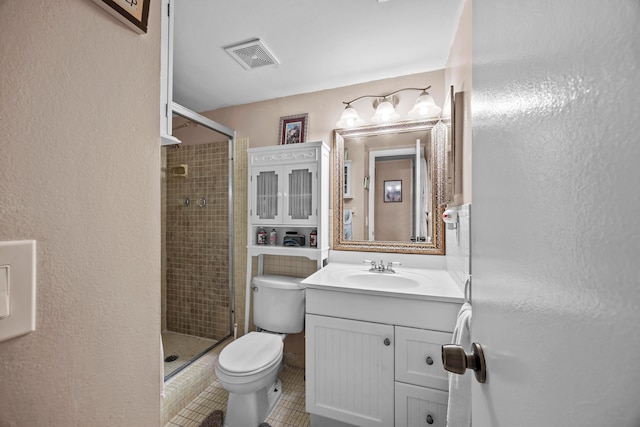 bathroom with walk in shower, tile patterned flooring, vanity, and toilet