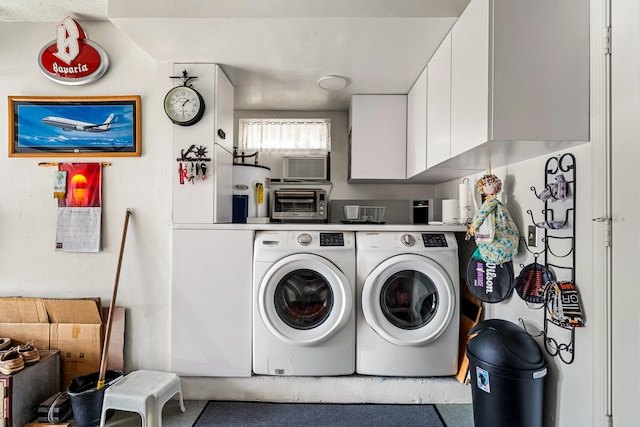 laundry area featuring electric water heater and separate washer and dryer