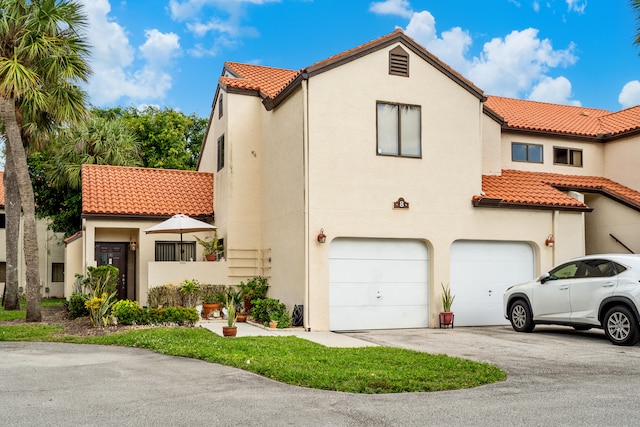 mediterranean / spanish-style home featuring a garage