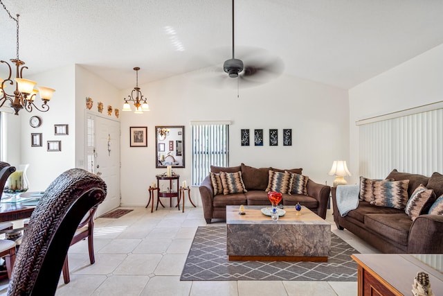 tiled living room with ceiling fan with notable chandelier, a textured ceiling, and vaulted ceiling