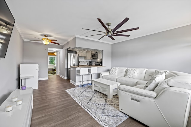 living room with ceiling fan, dark hardwood / wood-style floors, and crown molding