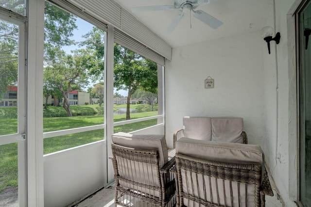 sunroom featuring ceiling fan and a healthy amount of sunlight