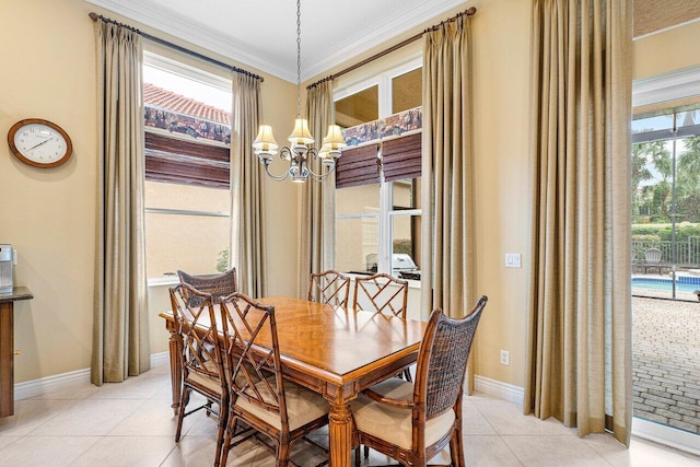 dining space featuring light tile patterned floors, an inviting chandelier, a wealth of natural light, and crown molding