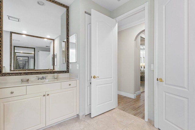 bathroom with hardwood / wood-style floors and vanity