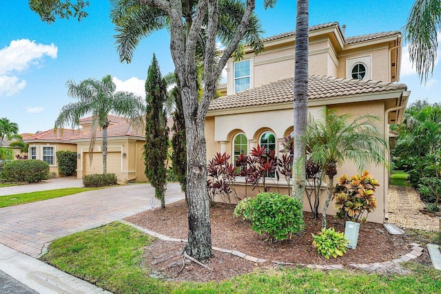 mediterranean / spanish-style home featuring a garage