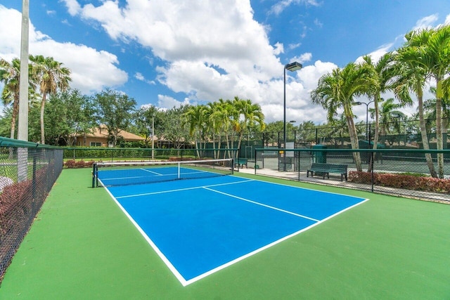 view of sport court with basketball hoop