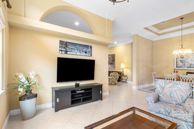 living room featuring crown molding, light tile patterned flooring, and an inviting chandelier