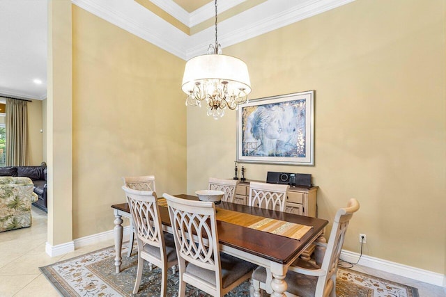 dining room with a notable chandelier, ornamental molding, and light tile patterned floors