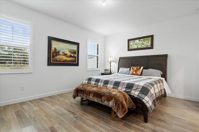 bedroom with light wood-type flooring