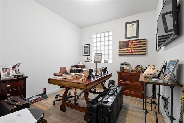 home office with light wood-type flooring