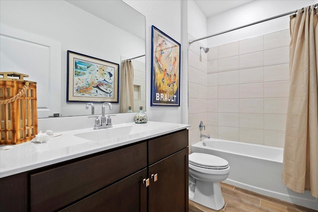 full bathroom featuring hardwood / wood-style floors, vanity, toilet, and shower / bathtub combination with curtain