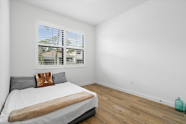 bedroom with light hardwood / wood-style floors