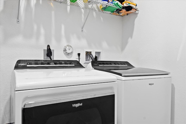 laundry area with independent washer and dryer