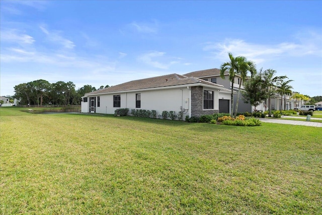 view of side of property with a yard