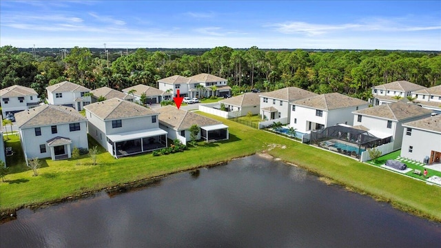 birds eye view of property with a water view