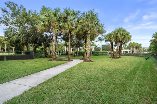 view of property's community featuring a yard