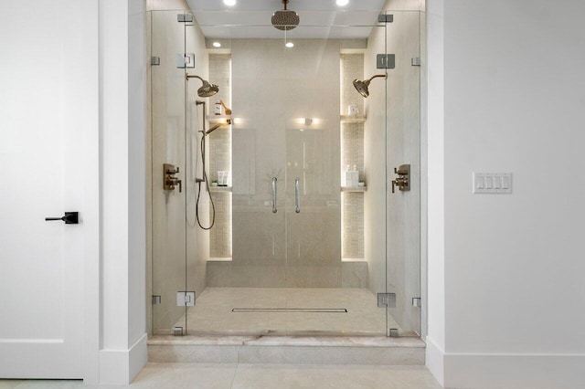 bathroom featuring tile patterned floors, a freestanding bath, plenty of natural light, and vanity