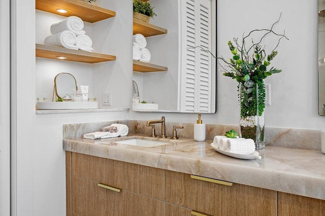 bathroom with a freestanding bath, baseboards, tile patterned flooring, and a healthy amount of sunlight