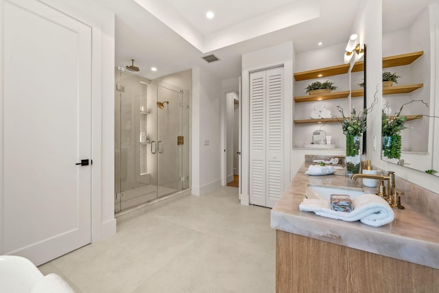 bedroom featuring baseboards, visible vents, multiple windows, and wood finished floors