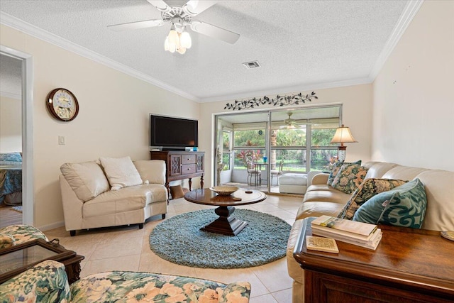 tiled living room featuring a textured ceiling, ceiling fan, and crown molding