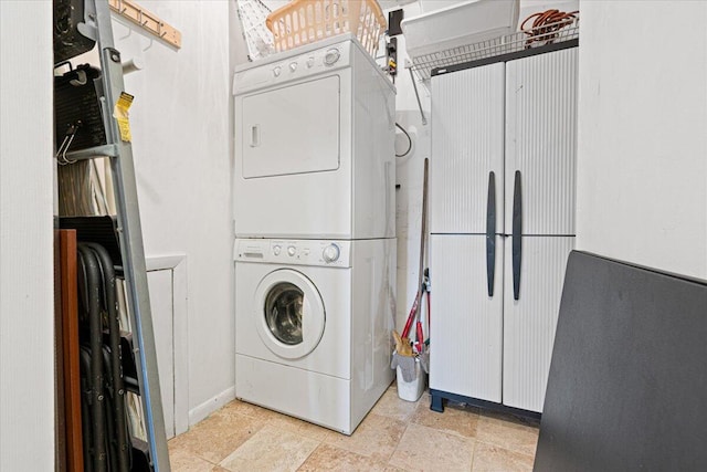 washroom with stacked washer and clothes dryer