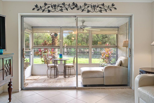 sunroom / solarium with plenty of natural light and ceiling fan