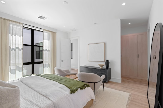 bedroom featuring light wood-type flooring