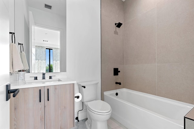 full bathroom with tile patterned flooring, vanity, toilet, and tiled shower / bath