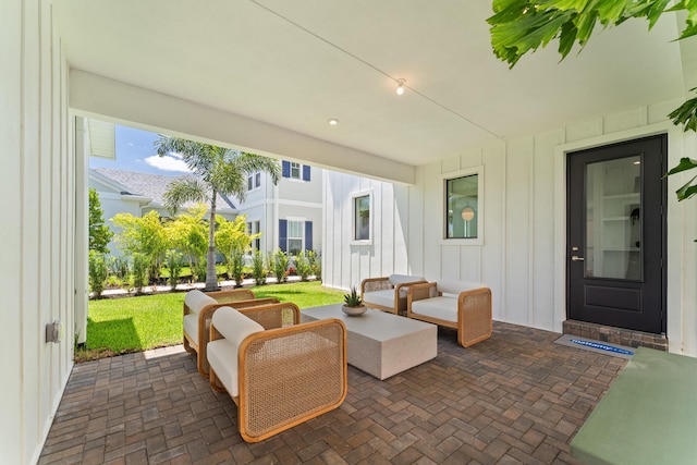 7751 SW Ann St, Palm City, FL 34990 - view of patio / terrace featuring outdoor lounge area
