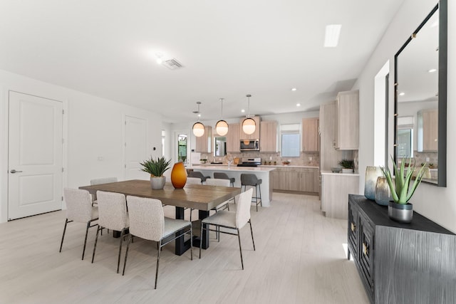 7751 SW Ann St, Palm City, FL 34990 - dining area featuring light wood finished floors and recessed lighting