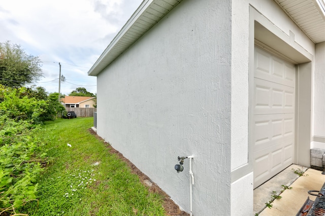 view of property exterior with a lawn