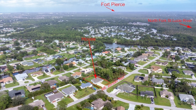 birds eye view of property featuring a water view