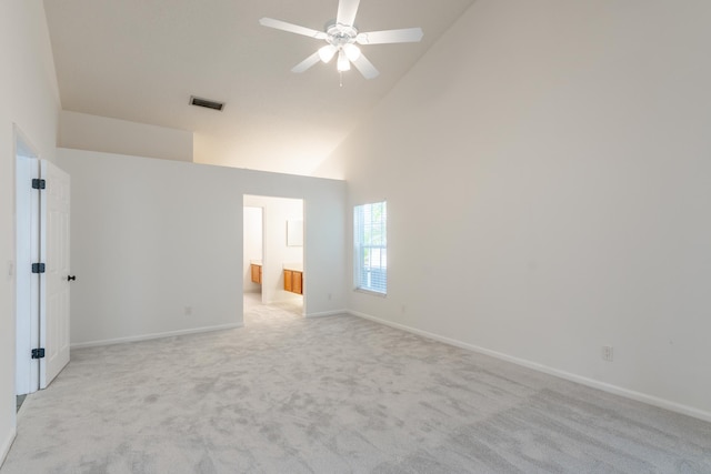 carpeted spare room featuring a textured ceiling and ceiling fan