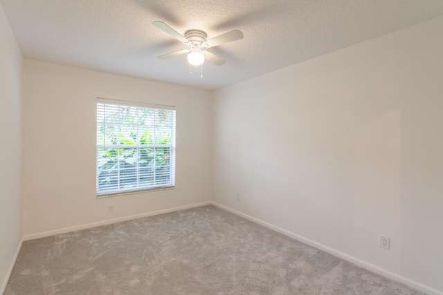 unfurnished sunroom featuring ceiling fan