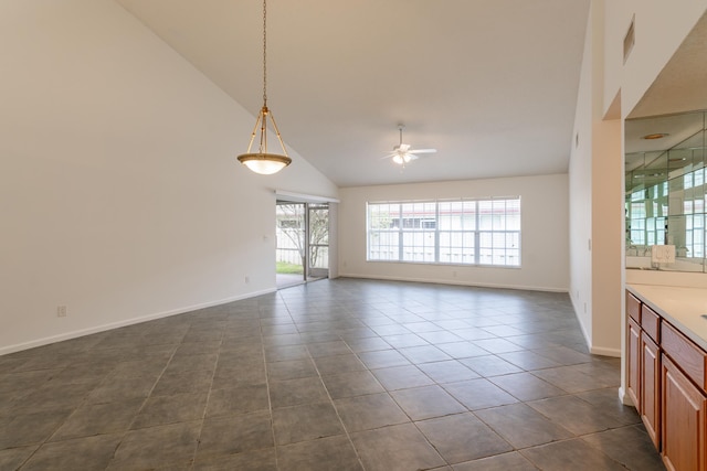 interior space featuring ceiling fan and high vaulted ceiling