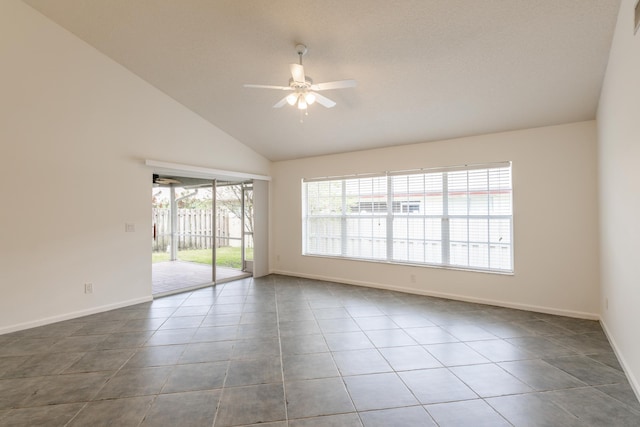 tiled spare room with high vaulted ceiling and ceiling fan