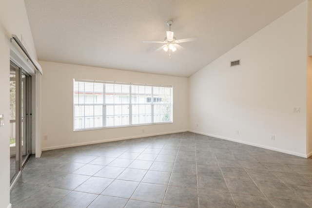 tiled spare room featuring a textured ceiling, high vaulted ceiling, and ceiling fan