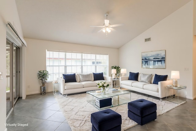 unfurnished living room featuring high vaulted ceiling, tile patterned flooring, and ceiling fan