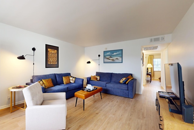 living room with light hardwood / wood-style floors