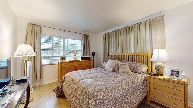 bedroom with light hardwood / wood-style floors