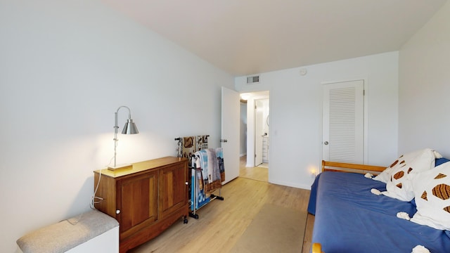 bedroom with light hardwood / wood-style floors