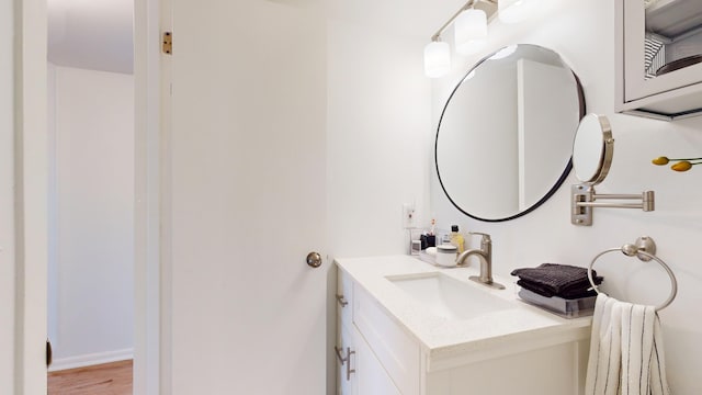 bathroom featuring vanity and wood-type flooring