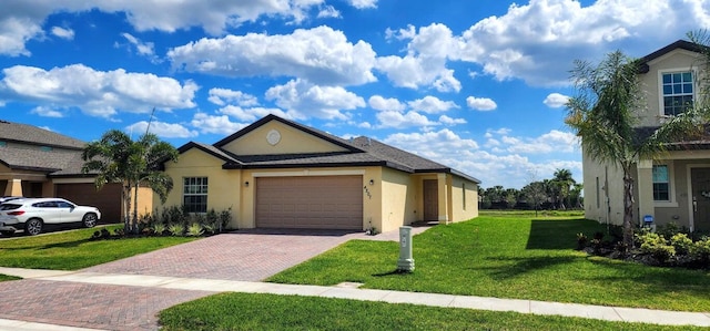 view of front of property with a garage and a front yard