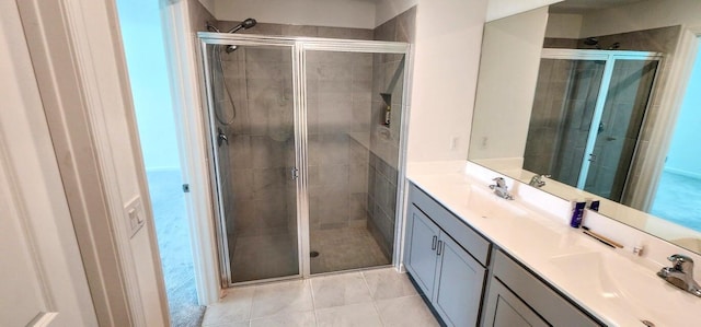 bathroom featuring vanity, walk in shower, and tile patterned flooring