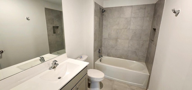 full bathroom with vanity, tiled shower / bath, and toilet