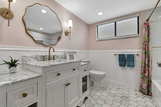 full bathroom featuring toilet, shower / bath combo, vanity, and tile patterned flooring