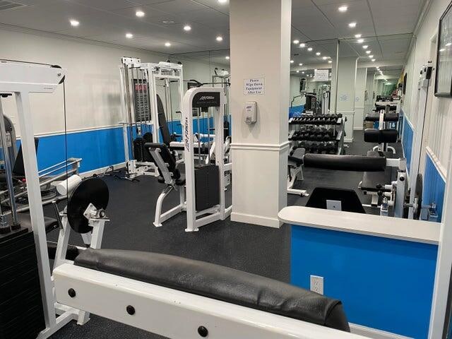 workout area with a paneled ceiling