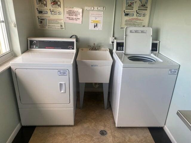 washroom featuring independent washer and dryer and sink